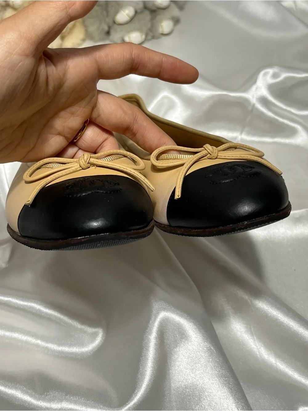 CHANEL Beige Leather Ballet Flats with Black Cap Toe and CC Logo